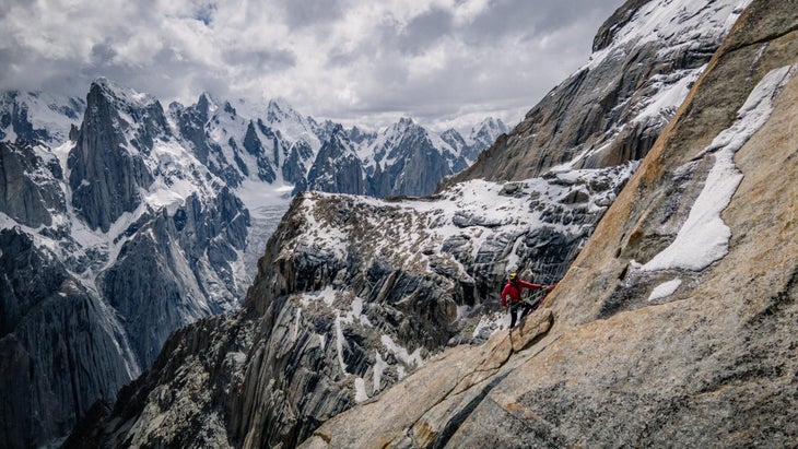 Climber hauls his bags in a big wall in Pakistan.