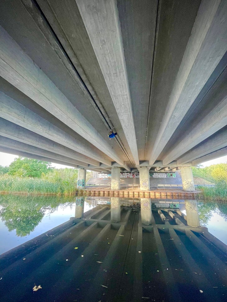 Tom Randall climbs the underside of a bridge in Germany.