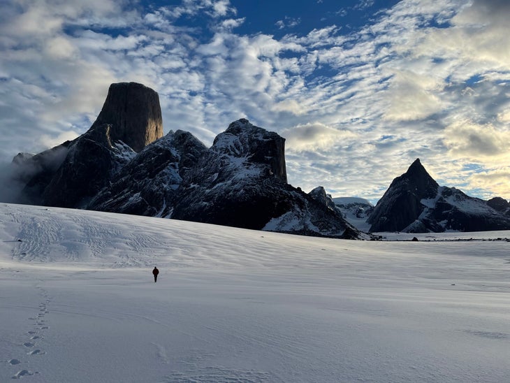 An American climber walking on the glacier in Baffin Island.