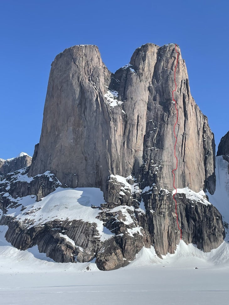 A distant shot of Mount Asgard, with the line of Memento Mori (5.10 A5 AI2; 3,600’) drawn in red.