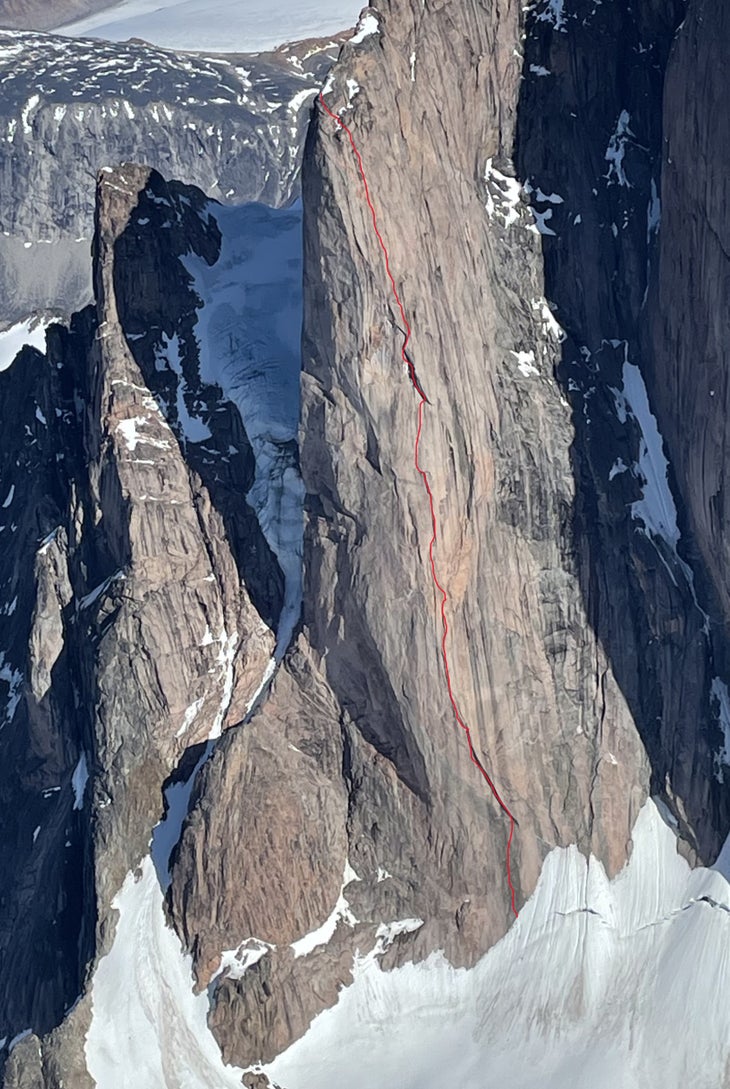 An aerial image of Frigga 1, in Baffin Island, with the line of Ragnarok (5.11 A5 2,500’) drawn in red ink up the center of the wall.