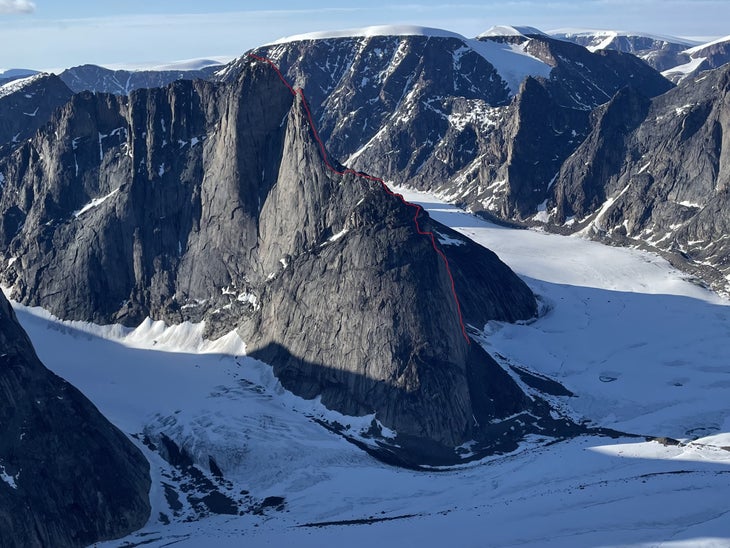 An distant image of Mount Loki, with the route "Fenrir" (5.11 A2; 4,500’) drawn in red.