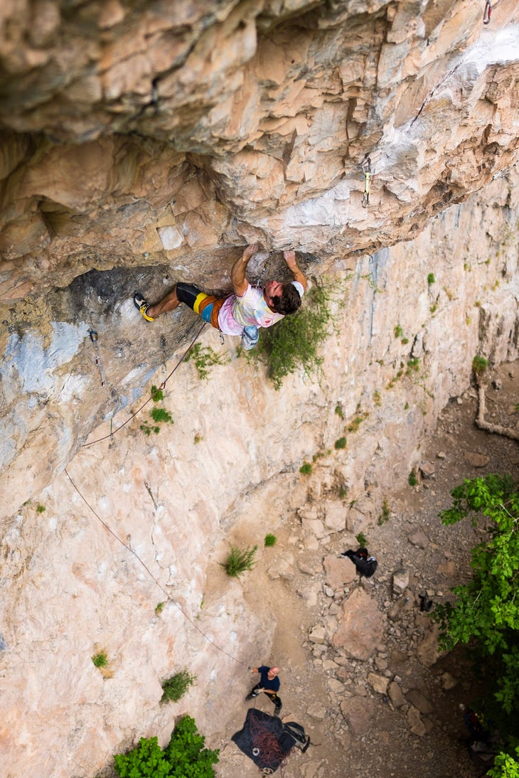 The author climbing moving up a steep overhang on his latest project: A 5.13d in Rifle.