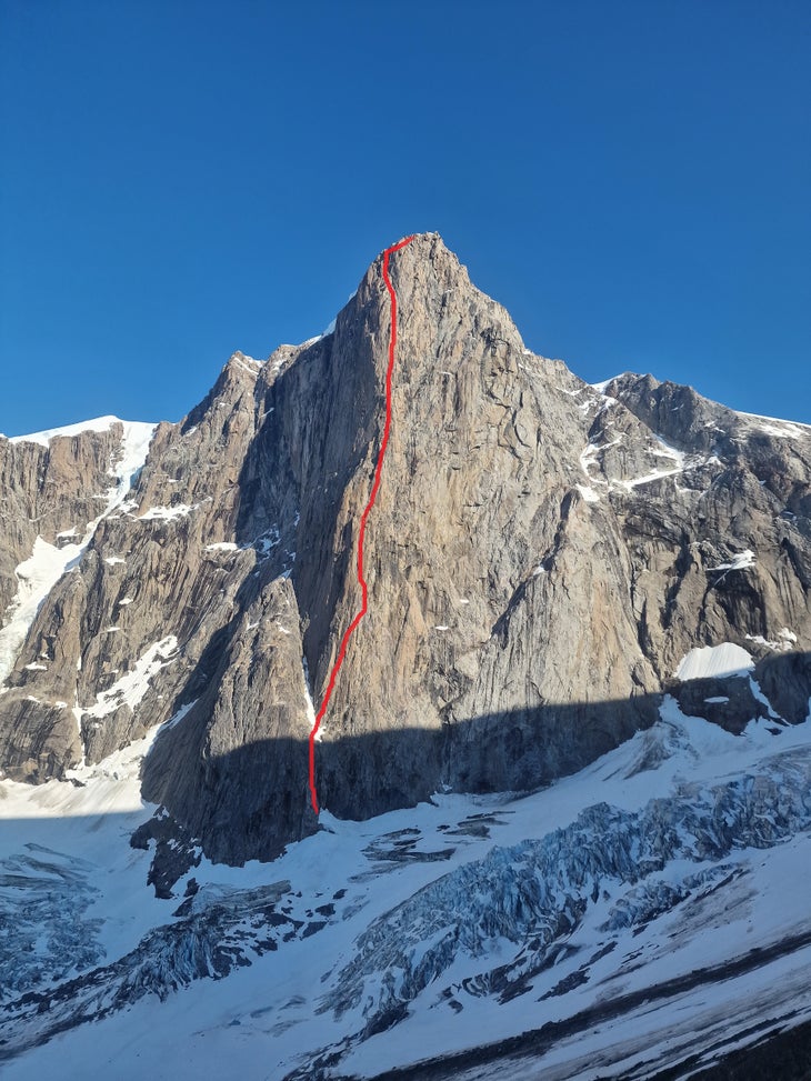 The steep north face of Drøneren (a “psychological” 5.12b; 1,200m), in Greenland on a sunny day with the climbing line illustrated in red ink.