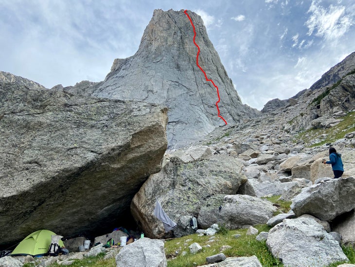 An image of a base camp set up in a boulder field below the Monolith—with a red line marking where "Children of the Sun" ascends the feature.
