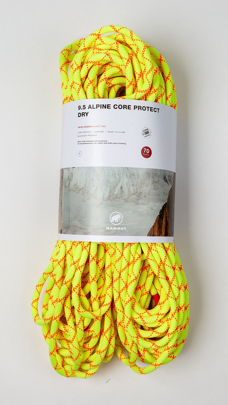 Bright yellow Mammut climbing rope on white background.