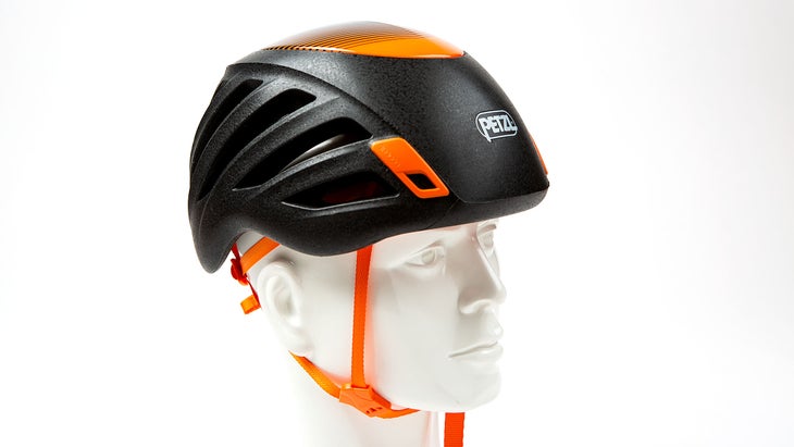 Black Petzl Sirocco climbing helment on white background.