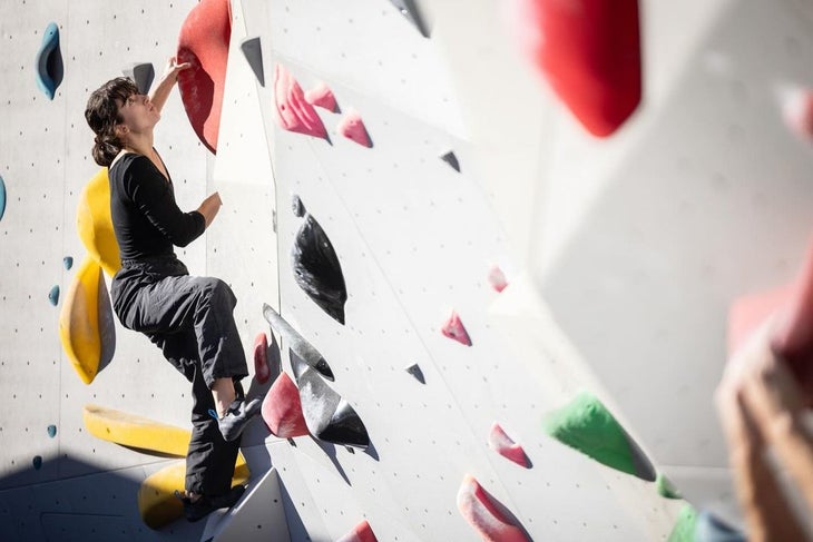 A woman climbing a moderate problem at the Boyce Boulder Park, in Allegheny County.