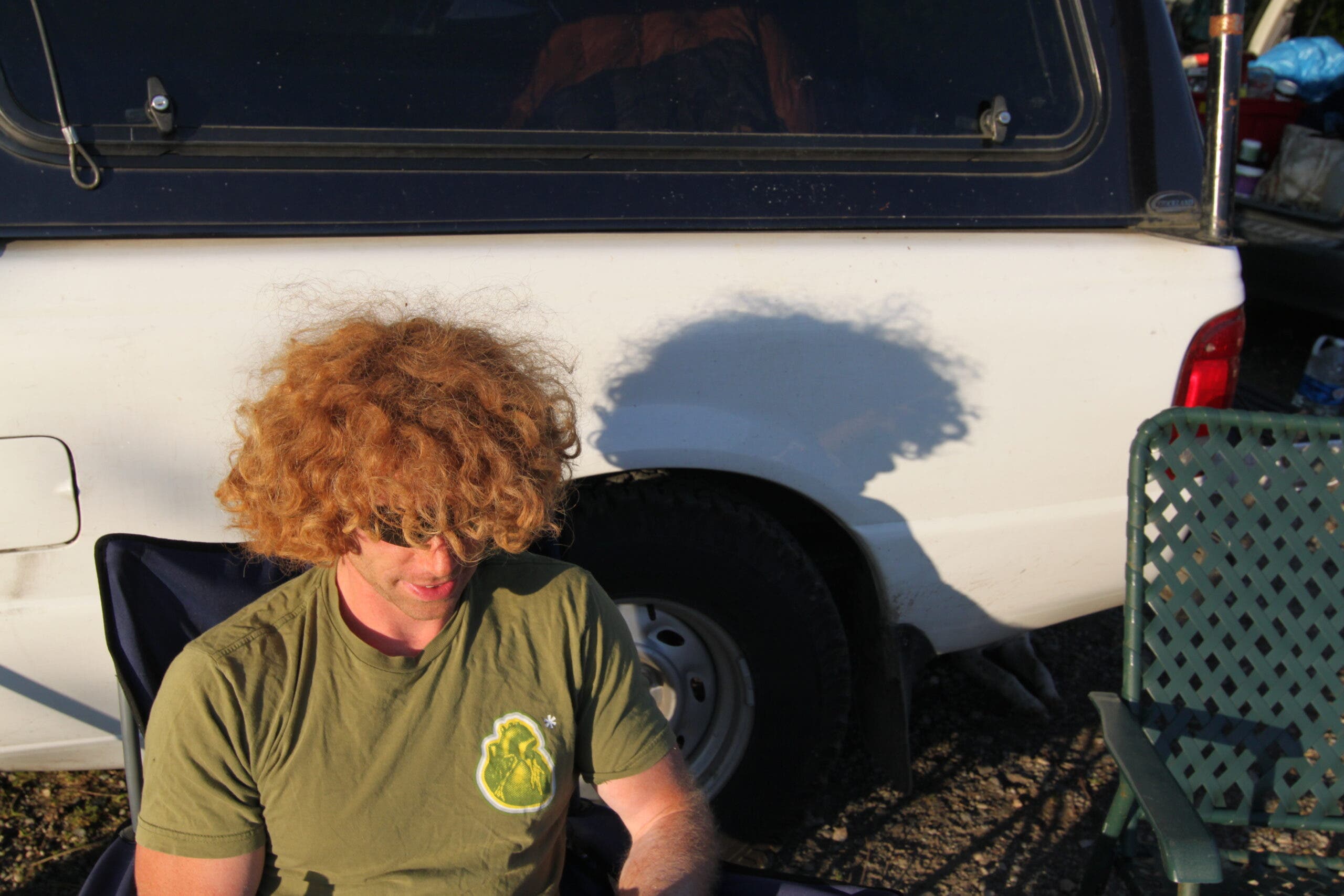 Johnny Goicoechea with a very large and messy mop of curly red hair.