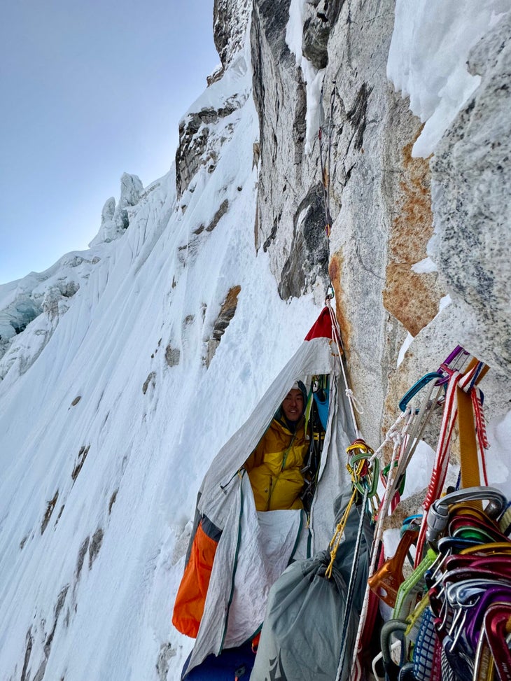 A portaledge camp on a snow-covered face.