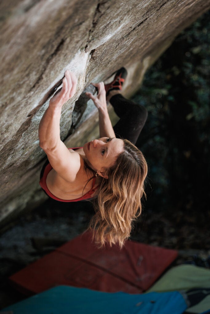 Michaela Kiersch on hte middle section of Dreamtime—doing the second move of the V12 stand start.