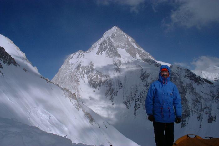 Javier Botella de Maglia with a gigantic, snow-covered peak in the background.