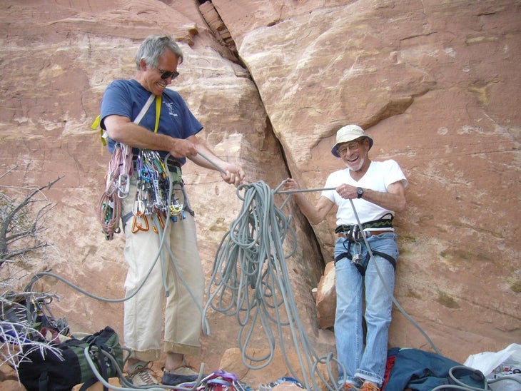 Two old men, one of them Burt, tugging at either end of a hopelessly tangled climbing rope.