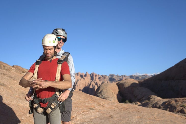 tandem BASE jumpers strapped together