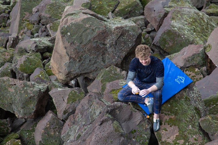 Daniel Frandson smiling to himself during a day at the boulders in Swan Falls.