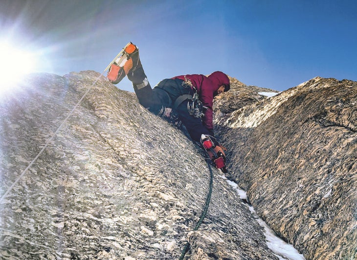 Vitaliy Musiyenko leads the delicate crack at the start of the second M7+ pitch on the north face.