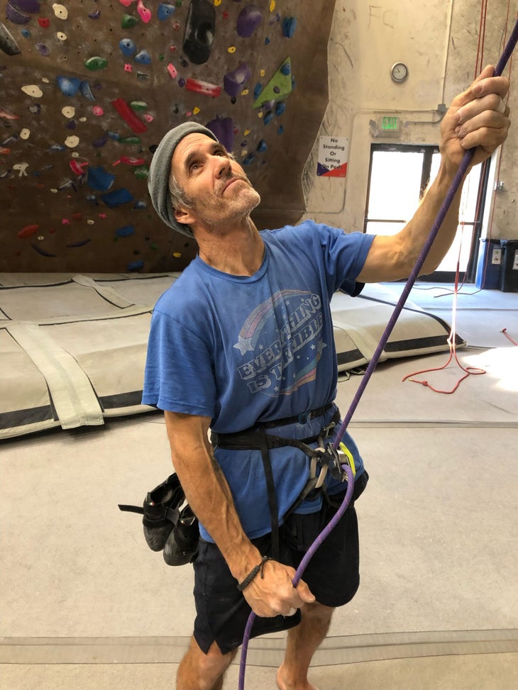 Tester Matt Samet reviewing the Edelrid Pinch belay device in a climbing gym.
