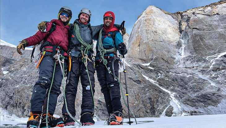 Christian Black, Hayden Wyatt, and Vitaliy Musiyenko (left to right) celebrate a safe descent from White Sapphire.