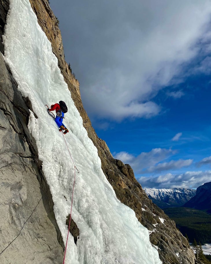 An ice climbing influencer leads WI3 ice. near Banff.