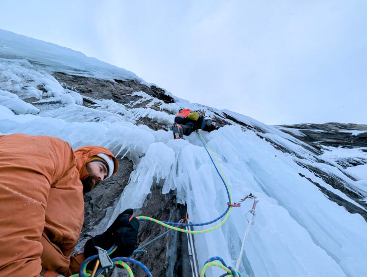 Jon Walsh, belayed by Seán Villanueva-O’Driscoll, leads the crux of a rarely formed Crash (WI5+) at the Storm Creek Headwall, B.C.
