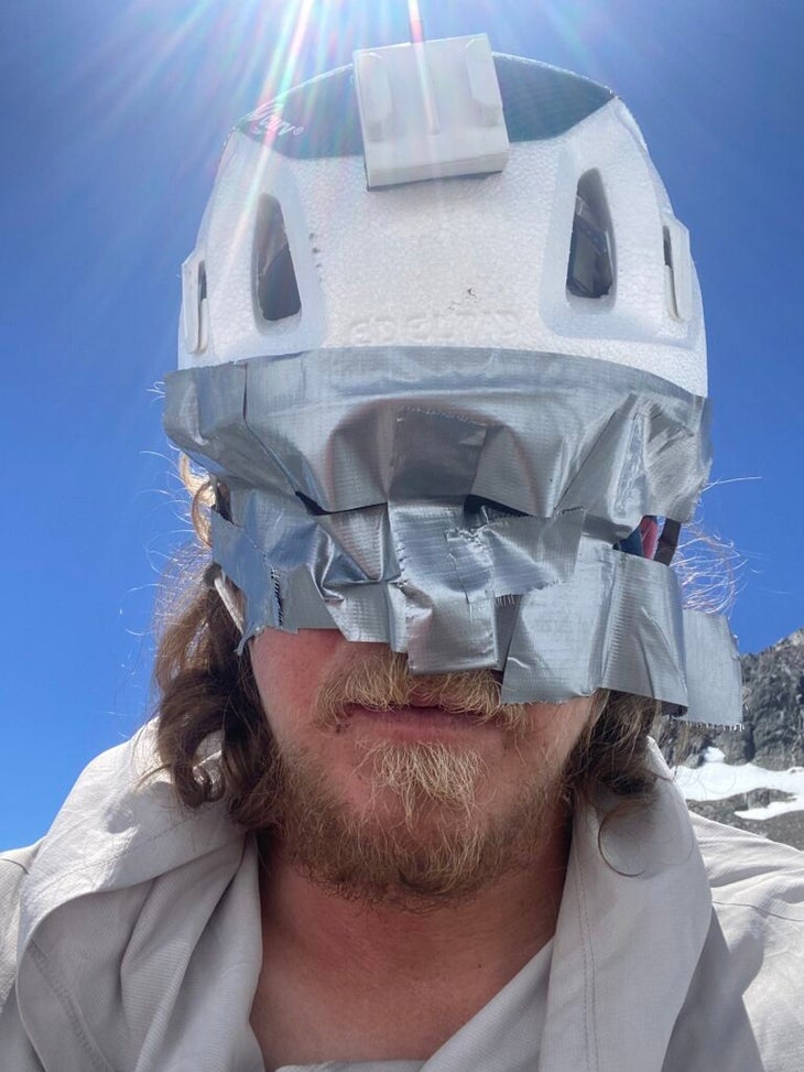 a man with duct tape over his eyes