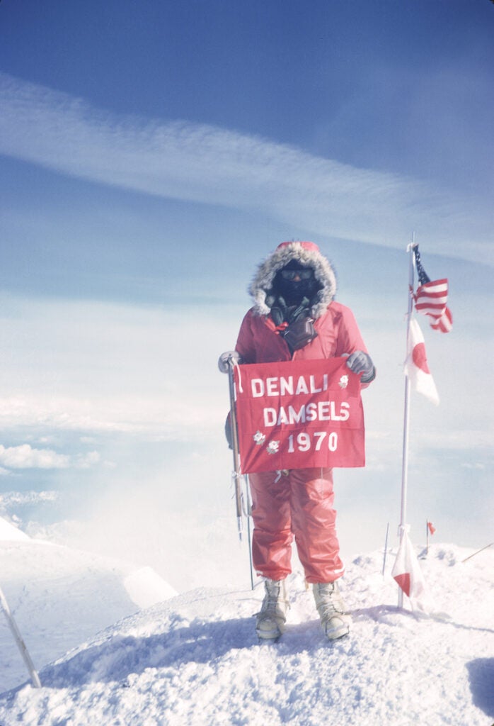 a climber stands on the summit during the first all female ascent of Denali 