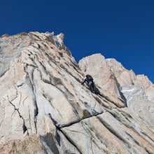 Nat Bailey climbs on the north side of Aguja Guilluamet, Patagonia.