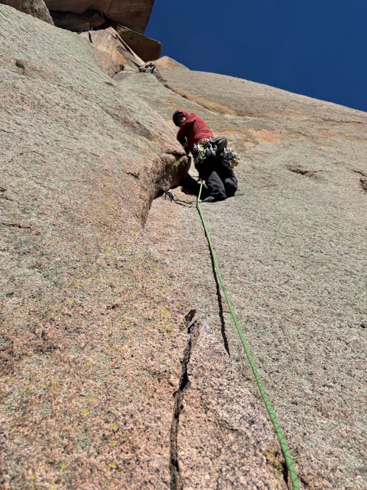 climber leading up a crack