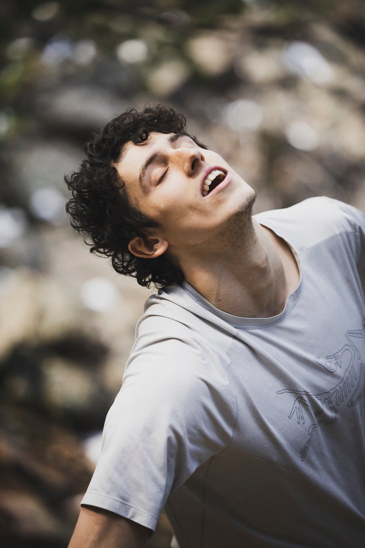 Hamish McArthur closes his eyes below Megatron boulder in CO.