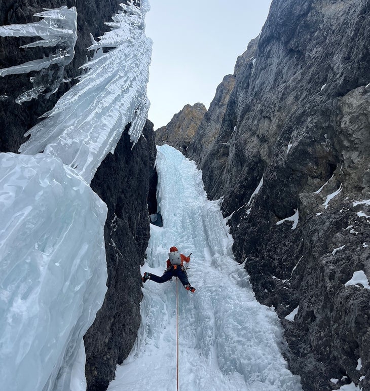The author on the crux pitch of High Five (WI 5; 200m) in Icefall Brook wearing the Patagonia M10 Jacket and Pants, which he considers the best waterproof jacket for climbing.