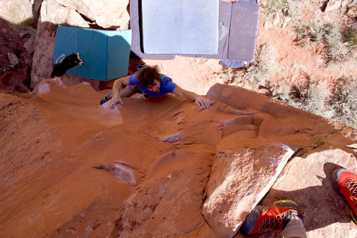 smiling while bouldering