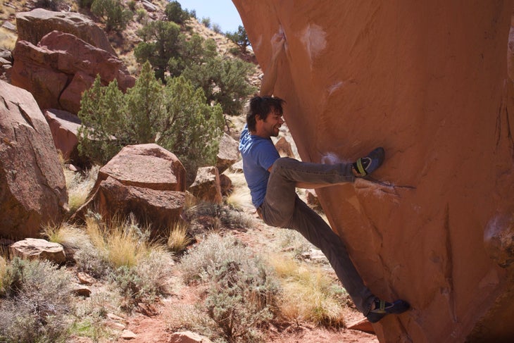 smiling and bouldering in Moab, Utah
