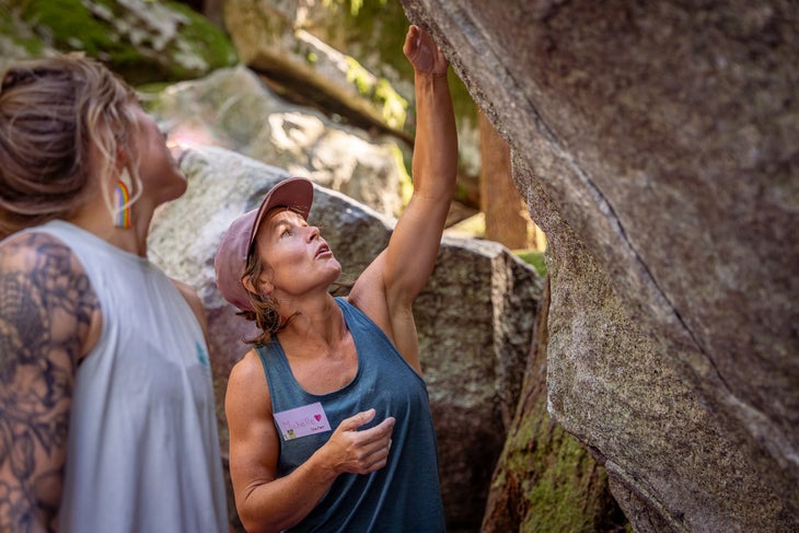 michelle leblanc with project pride talking to another climber