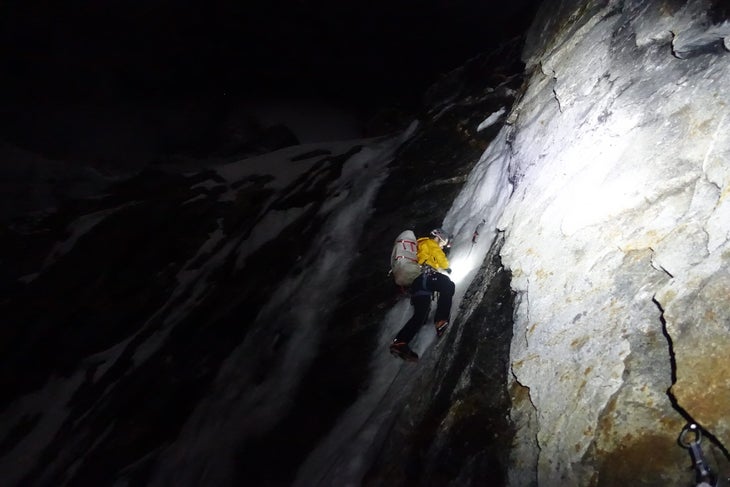 Maarten Van Haeren places a screw under the cover of night.