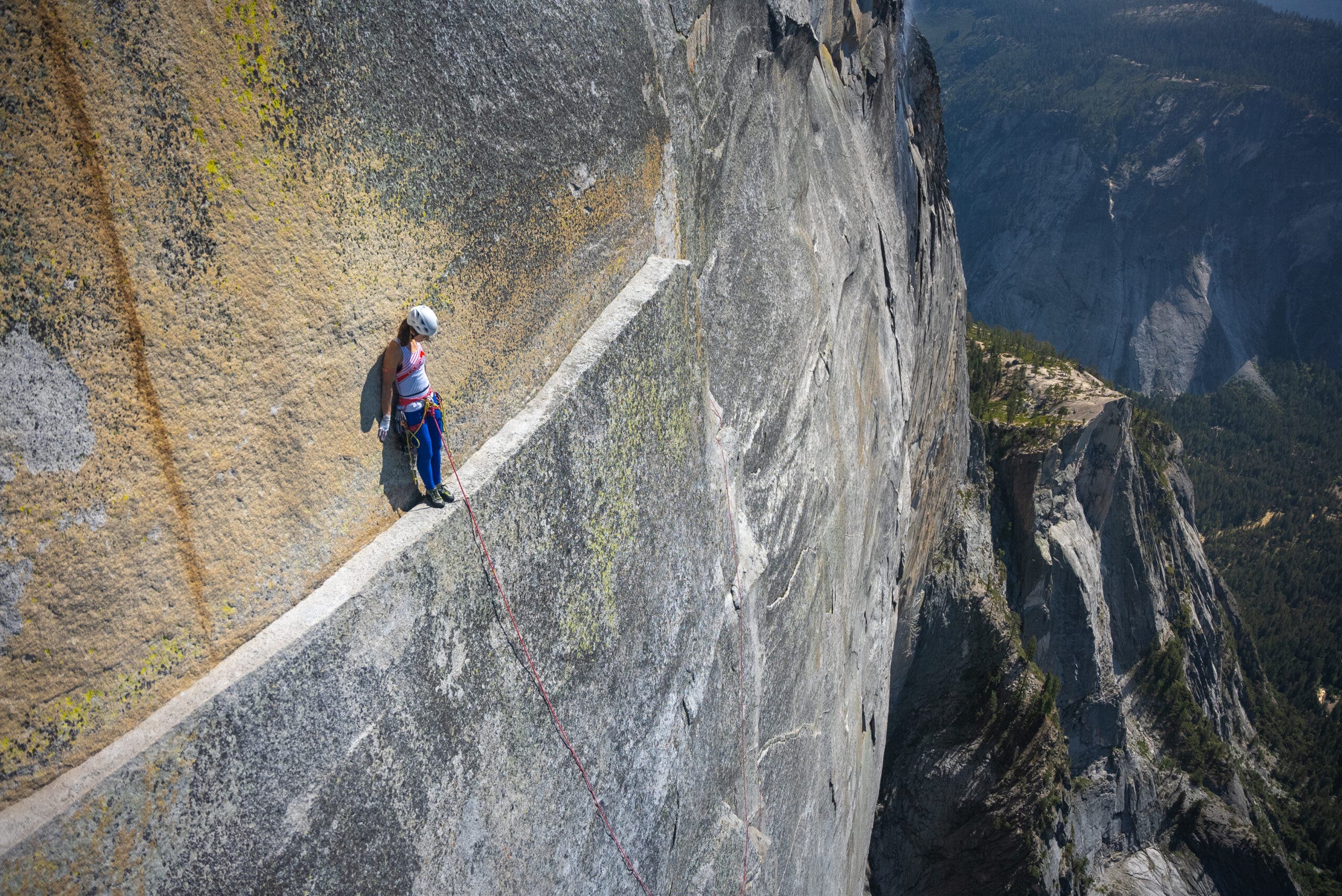 woman on ledge on half dome, yosemite