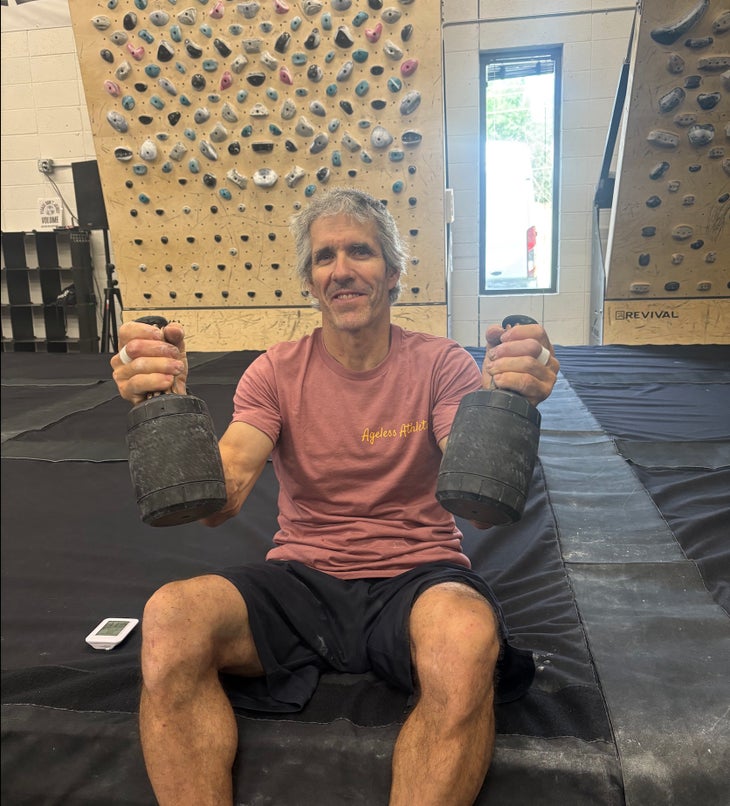 The author avoids doomscrolling between Tension Board problems with the Narwhal, a hand cooling device for climbers.