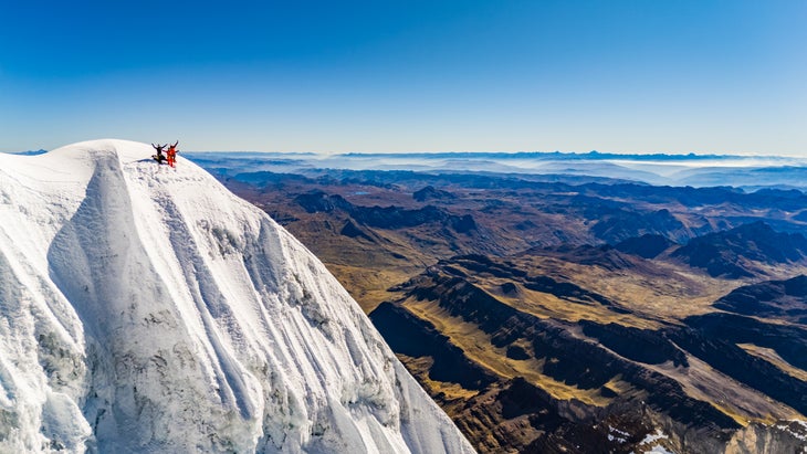 The team poses on their summit, with the top of the mountain conveniently out of view.