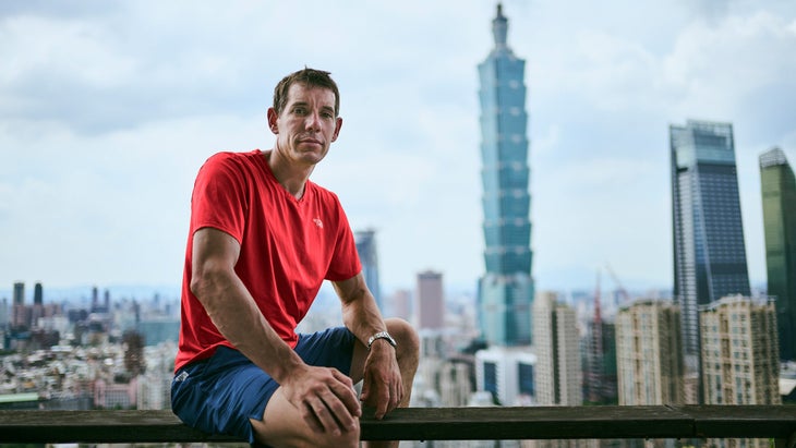 alex honnold with taipei 101 in the background