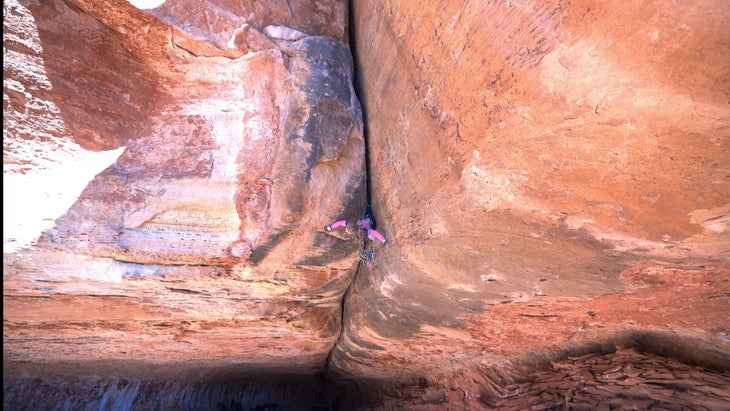 mary eden (trad princess) climbing a roof crack