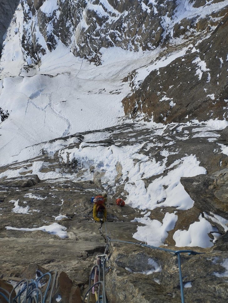Climber follows a steep, splitter pitch of drytooling on Aikache Chhok.