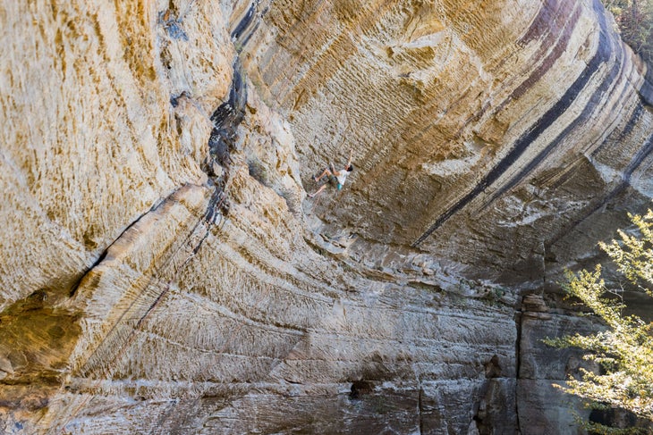 man climbing steep wall in The Venue in kentucky