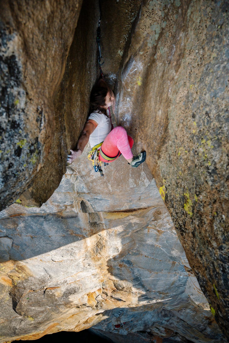 Laura Pineau climbs the famous bombay chimney pitch of 'Wet Lycra Nightmare' (5.13d A0).