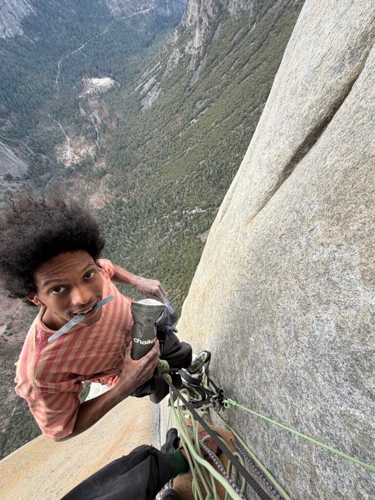 Teddy Eyob hanging from a rope on El Capitan