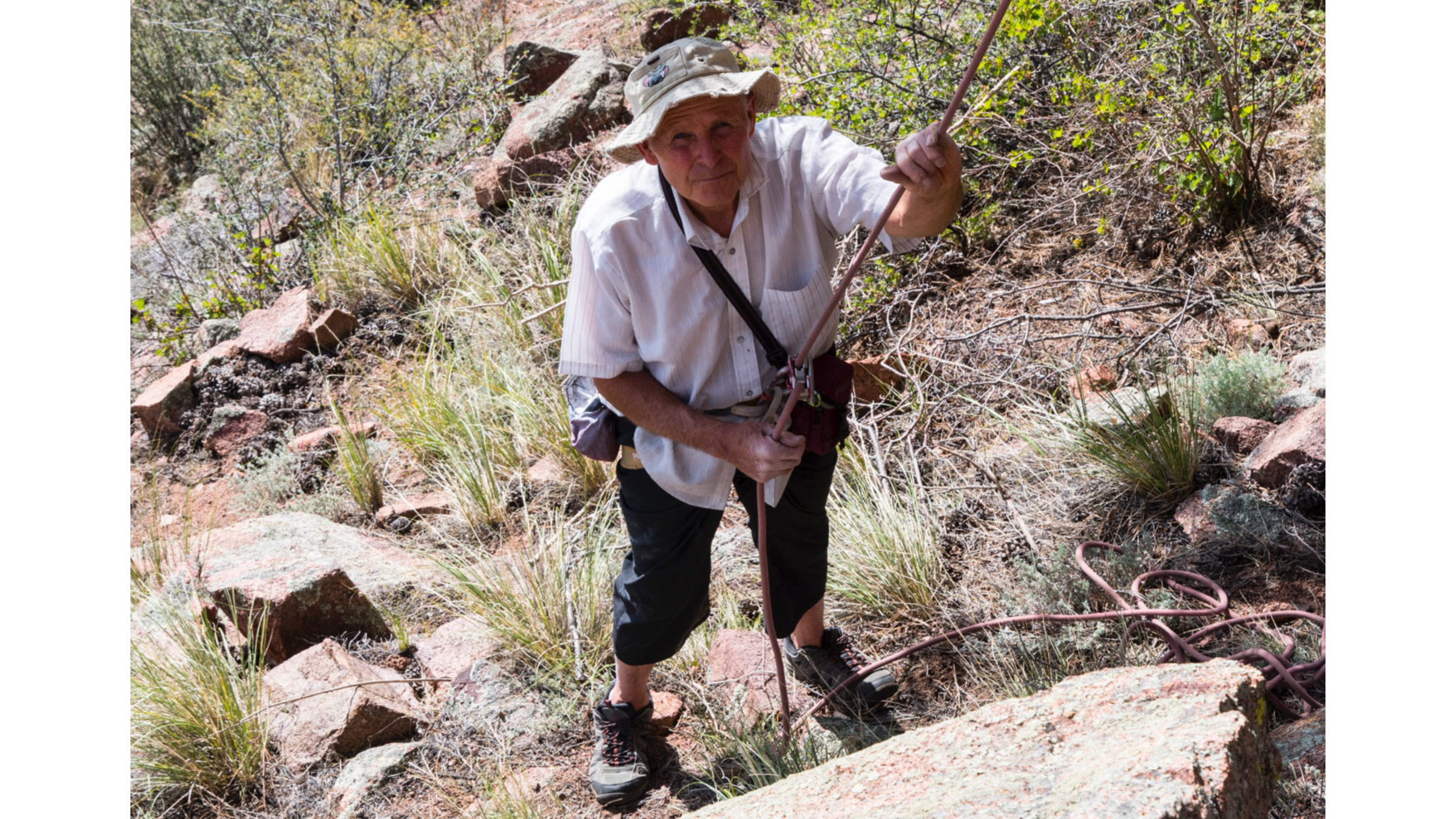 Climber Bob Robertson, shown outside with climbing harness and holding rope and wearing a bucket hat, who died on January 31, 2025