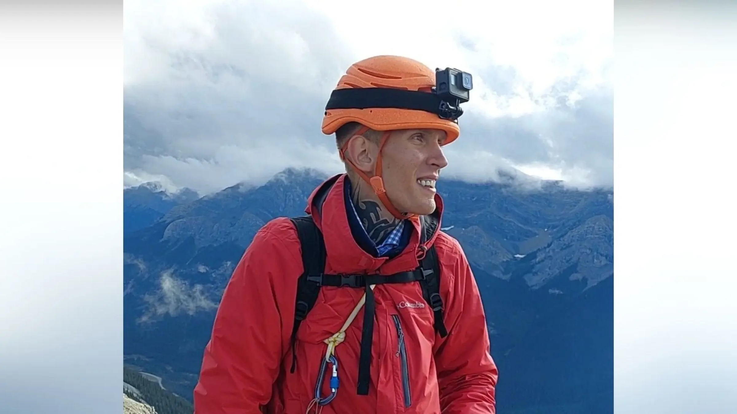 climber Eugene Vahin, at mountaintop wearing orange helmet and red jacket, who died January 23, 2025