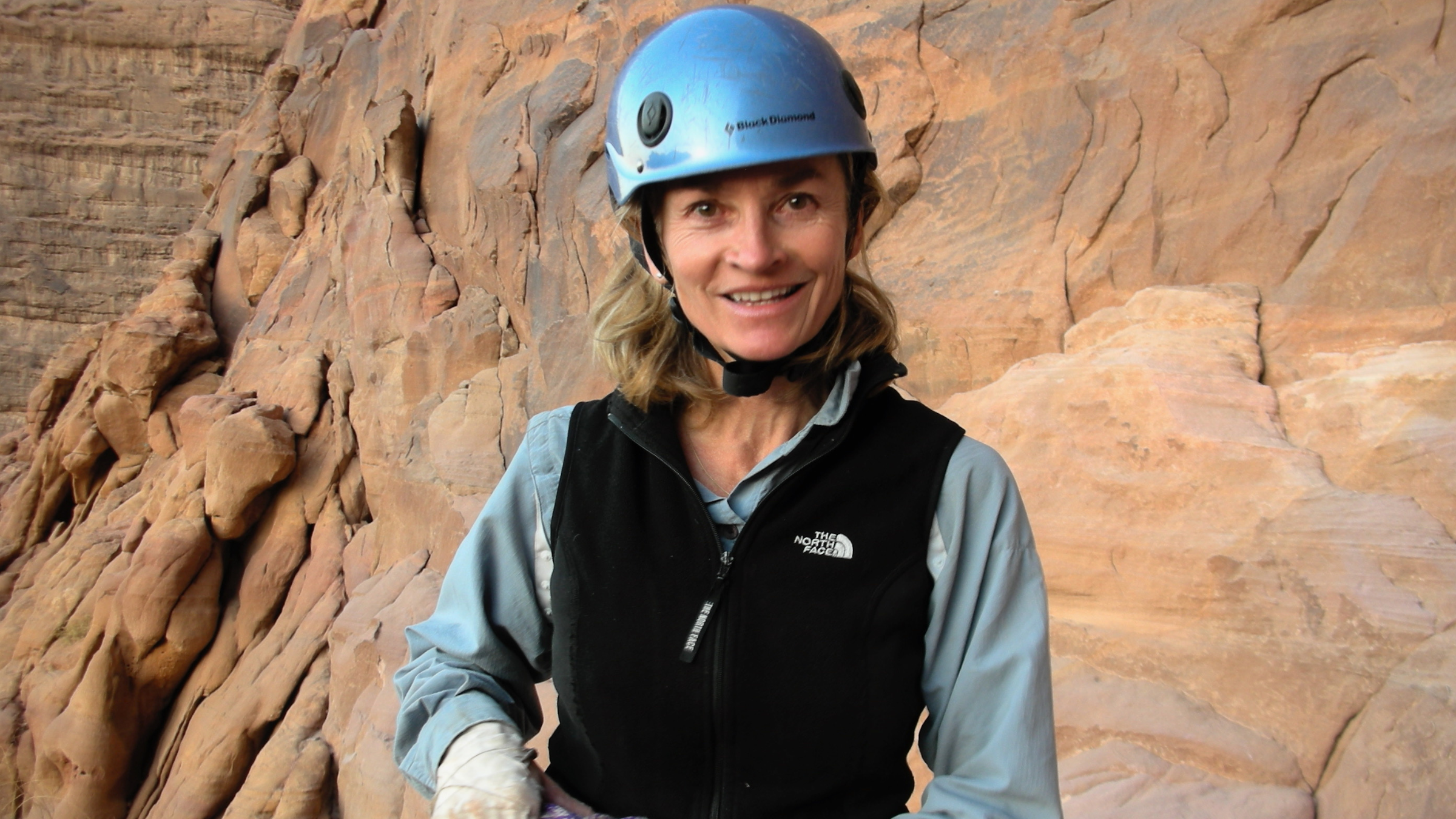 Climber Franziska Garrett, seen here in climbing gear and helmet looking at the camera, died on October 17, 2025