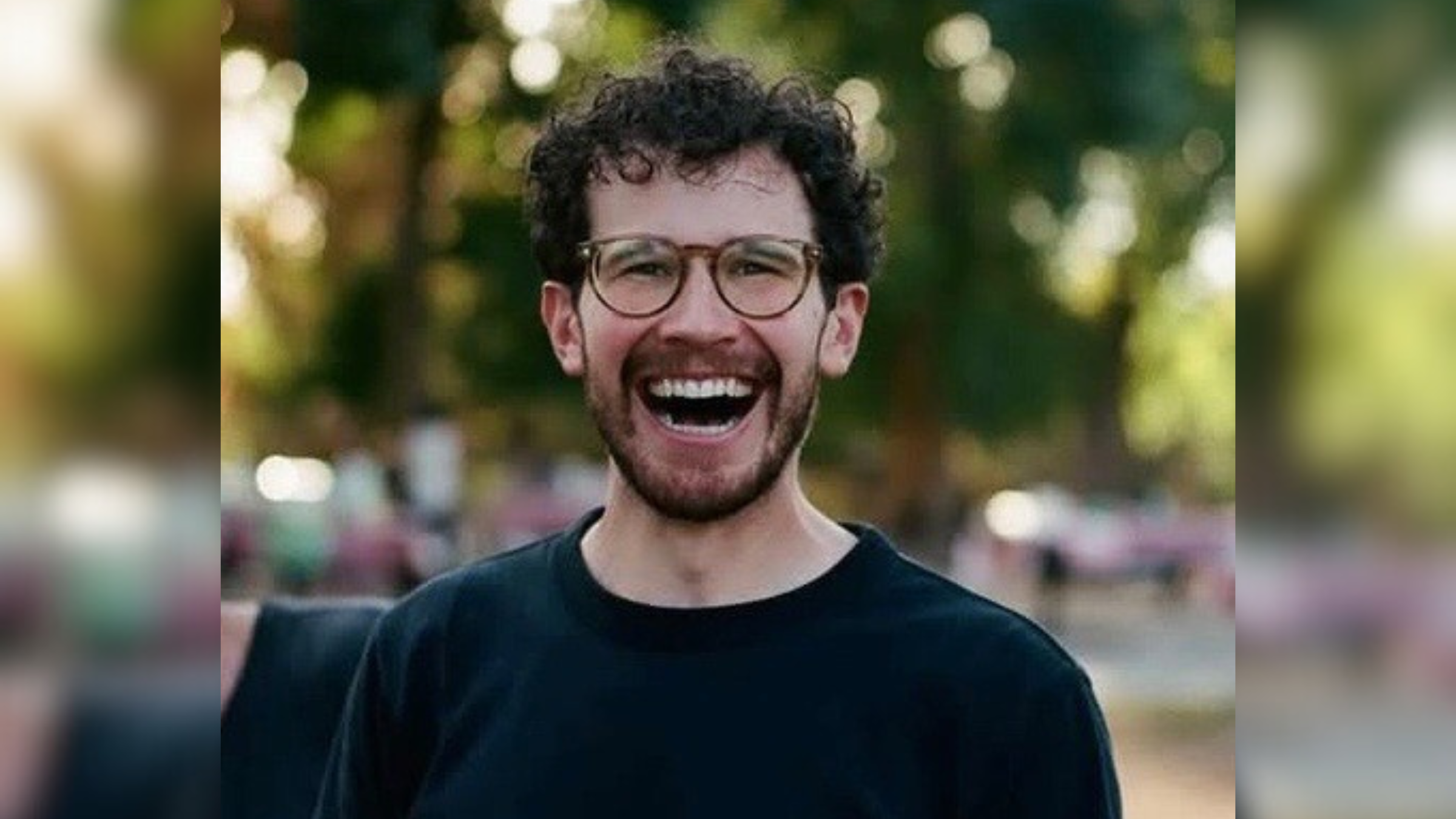 Climber Jon Schleicher, shown here smiling and wearing a black sweater and glasses, died on June 26, 2025