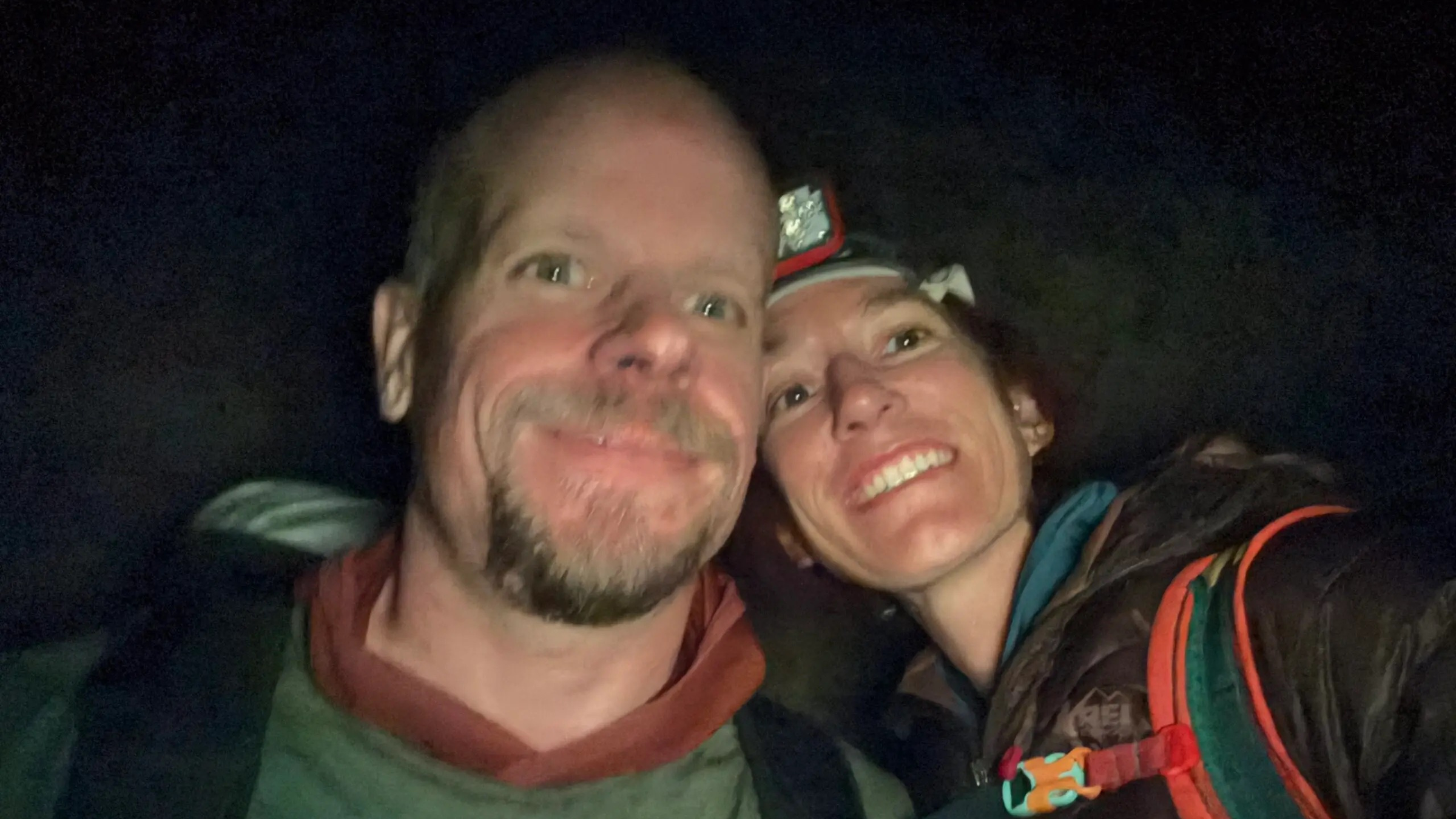 selfie of man, climber Marc Horan, and partner, Sarah Zubrin, in darkness with flash; Horan died on March 23, 2026