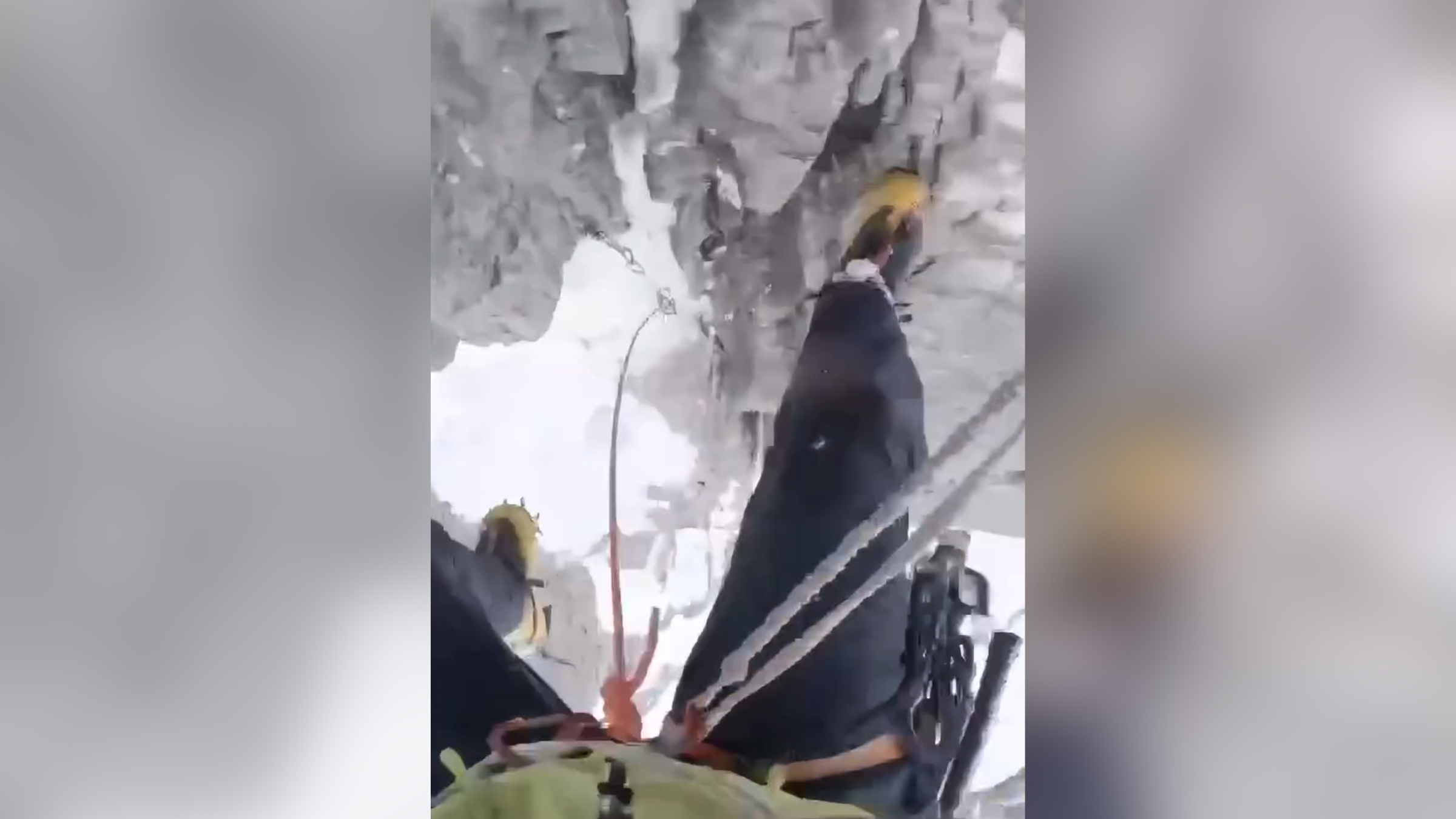 Alpine climbing scene illustrating a safety rule broken