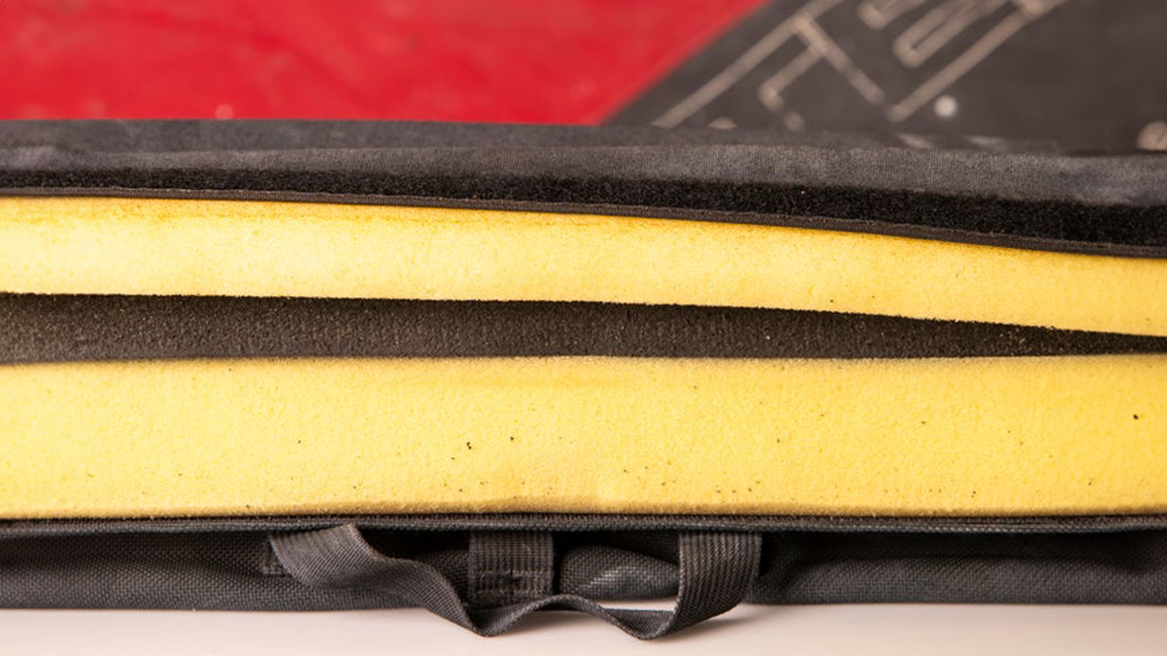 Crashpads are constructed by layering open cell and closed cell foam to disperse the force of a falling climber.